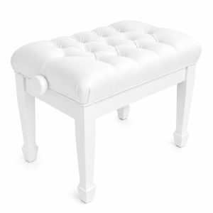 White tufted upholstered ottoman with four square legs and a round side knob on the left.