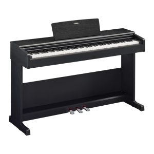 Black digital piano with three pedals and a matching stand, viewed from the front, Yamaha branding visible at the backrest of the keyboard