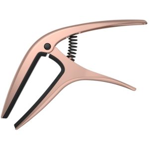 Rose-gold spring-loaded hand grip/clamp with curved jaws, a small exercise tool for finger or hand strengthening.